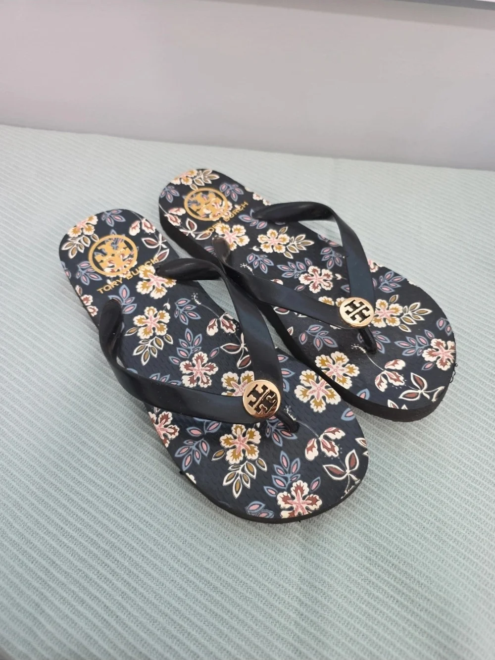 Tory Burch Navy Floral Logo Flip Flops with Gold Medallions